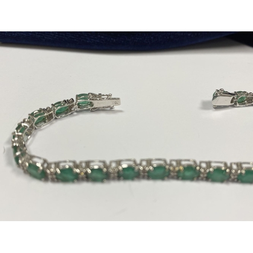 4 - AN 18CT WHITE GOLD EMERALD & DIAMOND TENNIS BRACELET, set with oval cut emeralds separated by two ro... 