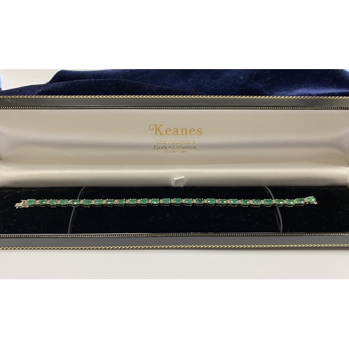 4 - AN 18CT WHITE GOLD EMERALD & DIAMOND TENNIS BRACELET, set with oval cut emeralds separated by two ro... 