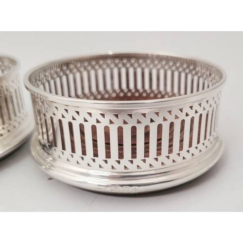 40 - A FINE PAIR OF 20TH CENTURY SILVER WINE COASTERS, with pierced decoration to the raised gallery side... 