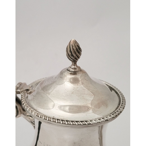 44 - A GOOD QUALITY EARLY 20TH CENTURY SILVER HOT-WATER POT / BATCHELOR'S TEA POT, with ebony scroll shap... 