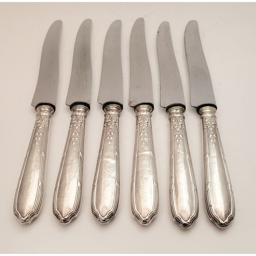 46 - A GOOD SET OF SIX LATE 19TH CENTURY FRENCH SILVER HANDLED DINNER KNIVES, the handles decorated with ... 