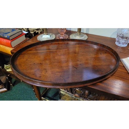 54 - A LARGE IRISH GEORGIAN QUAKER FAMILY MAHOGANY OVAL SHAPED BUTLER’S TRAY, with raised gallery edge. N... 