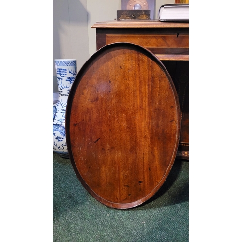 54 - A LARGE IRISH GEORGIAN QUAKER FAMILY MAHOGANY OVAL SHAPED BUTLER’S TRAY, with raised gallery edge. N... 