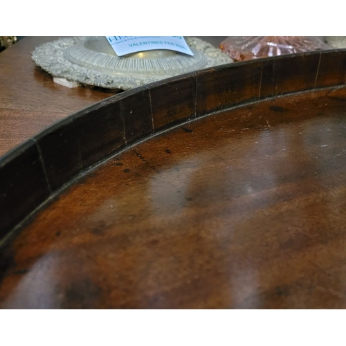 54 - A LARGE IRISH GEORGIAN QUAKER FAMILY MAHOGANY OVAL SHAPED BUTLER’S TRAY, with raised gallery edge. N... 