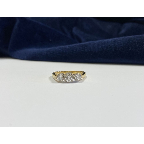 59 - A STUNNING IRISH 18CT YELLOW GOLD THREE STONE DIAMOND RING, with central round brilliant cut diamond... 