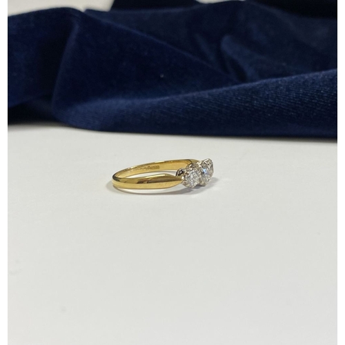 59 - A STUNNING IRISH 18CT YELLOW GOLD THREE STONE DIAMOND RING, with central round brilliant cut diamond... 