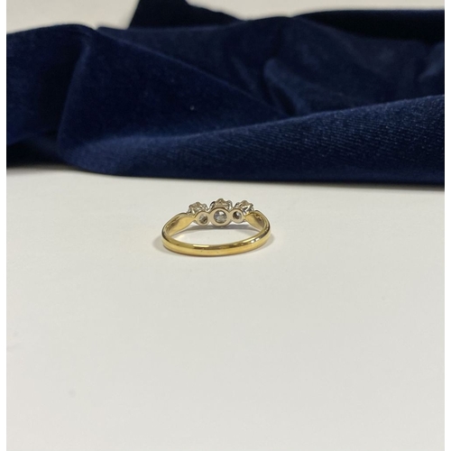 59 - A STUNNING IRISH 18CT YELLOW GOLD THREE STONE DIAMOND RING, with central round brilliant cut diamond... 