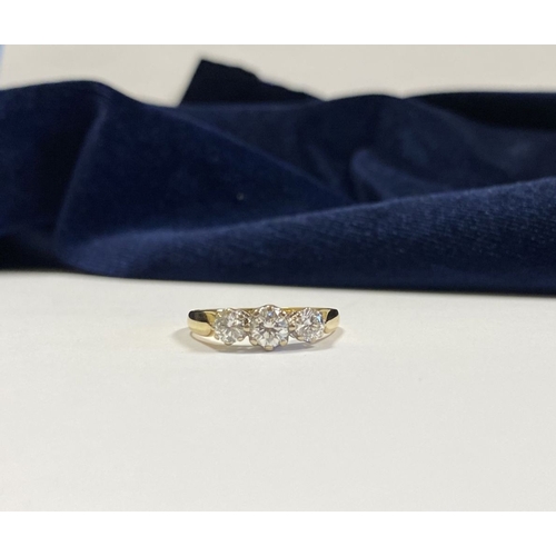 59 - A STUNNING IRISH 18CT YELLOW GOLD THREE STONE DIAMOND RING, with central round brilliant cut diamond... 