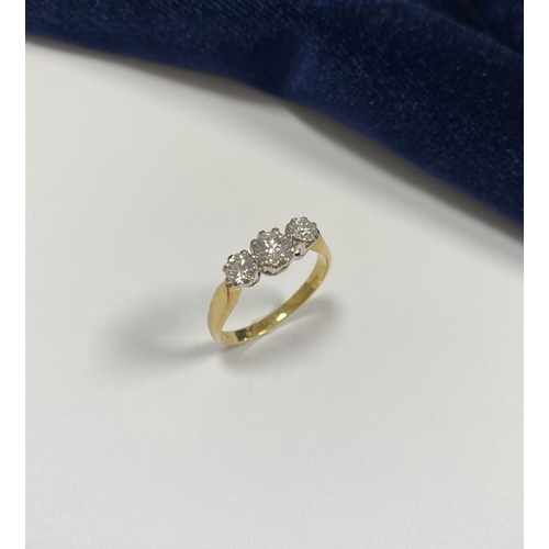 59 - A STUNNING IRISH 18CT YELLOW GOLD THREE STONE DIAMOND RING, with central round brilliant cut diamond... 