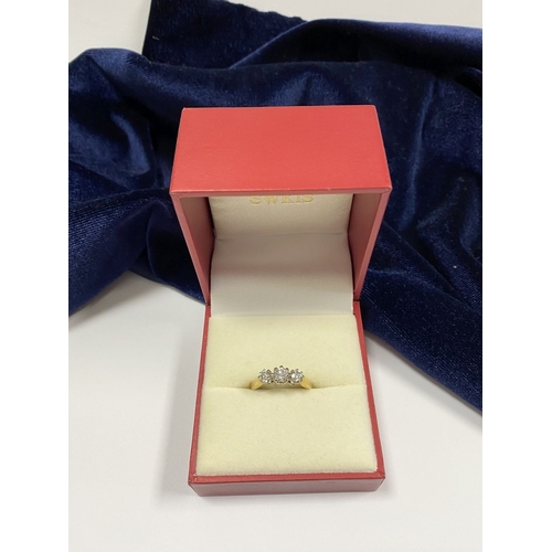 59 - A STUNNING IRISH 18CT YELLOW GOLD THREE STONE DIAMOND RING, with central round brilliant cut diamond... 