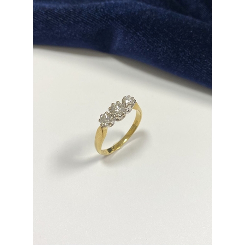 59 - A STUNNING IRISH 18CT YELLOW GOLD THREE STONE DIAMOND RING, with central round brilliant cut diamond... 