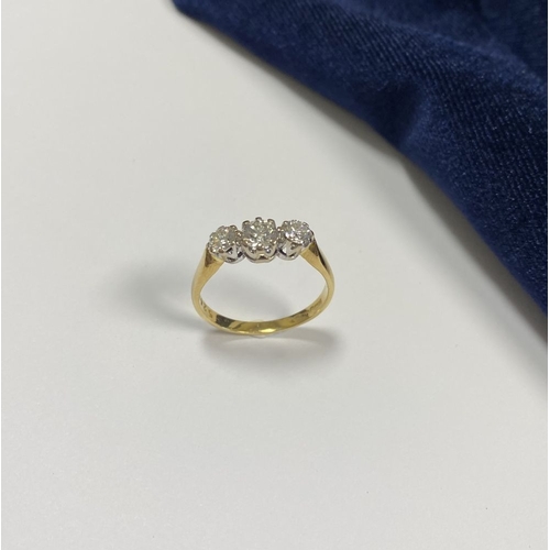 59 - A STUNNING IRISH 18CT YELLOW GOLD THREE STONE DIAMOND RING, with central round brilliant cut diamond... 