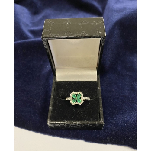 72 - A 14CT GOLD EMERALD & DIAMOND VAN CLEEF STYLE RING, with four central pear cut emeralds surrounded b... 