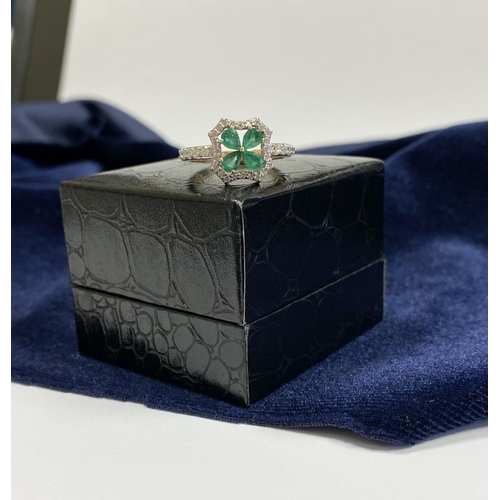 72 - A 14CT GOLD EMERALD & DIAMOND VAN CLEEF STYLE RING, with four central pear cut emeralds surrounded b... 