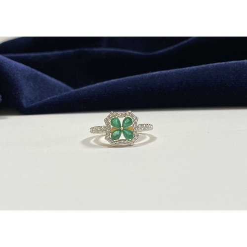 72 - A 14CT GOLD EMERALD & DIAMOND VAN CLEEF STYLE RING, with four central pear cut emeralds surrounded b... 