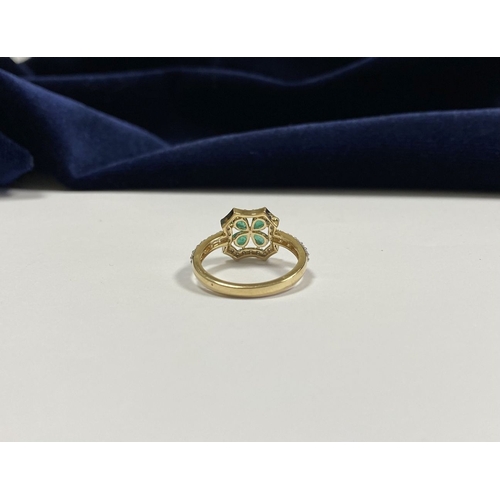 72 - A 14CT GOLD EMERALD & DIAMOND VAN CLEEF STYLE RING, with four central pear cut emeralds surrounded b... 