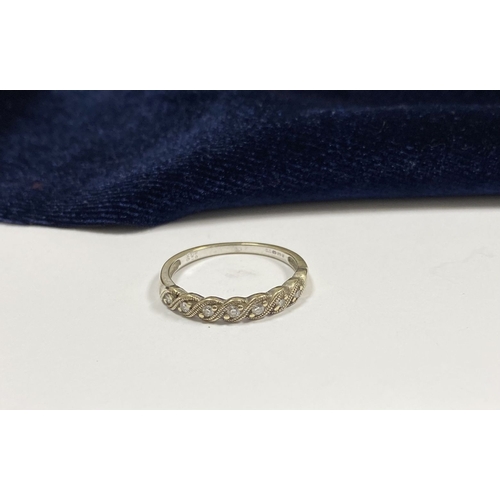 80 - A PRETTY 9CT WHITE GOLD SEVEN STONE DIAMOND RING, with seven round cut diamonds, graduating in size ... 