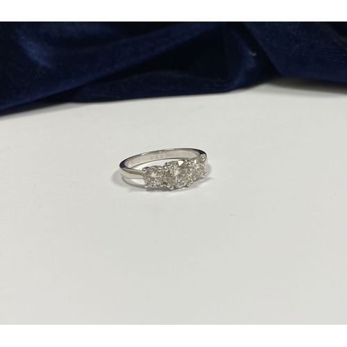 82 - AN 18CT WHITE GOLD THREE STONE DIAMOND RING, the central round brilliant cut diamond is 1ct approx. ... 