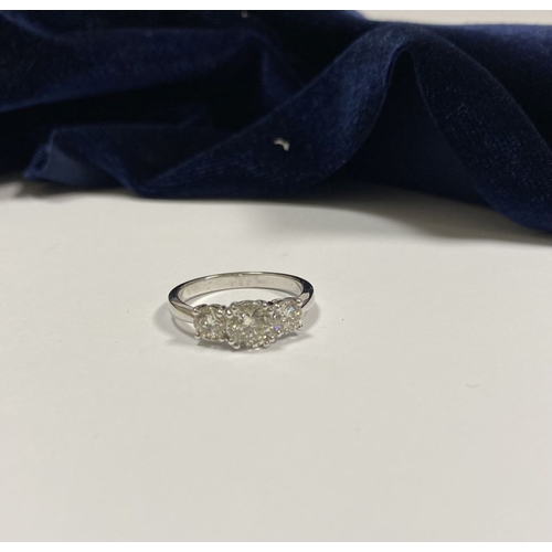 82 - AN 18CT WHITE GOLD THREE STONE DIAMOND RING, the central round brilliant cut diamond is 1ct approx. ... 