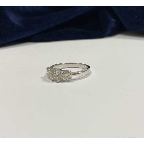 82 - AN 18CT WHITE GOLD THREE STONE DIAMOND RING, the central round brilliant cut diamond is 1ct approx. ... 