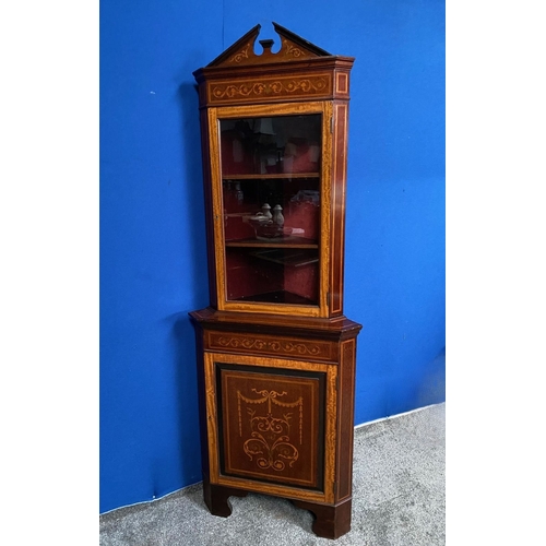 83 - AN EXCELLENT QUALITY MAHOGANY INLAID CORNER CABINET, with pediment to top, above door with glass pan... 