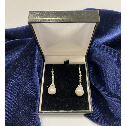 85 - AN ELEGANT PAIR OF 18CT WHITE GOLD PEARL & DIAMOND DROP EARRINGS, the pearls are set in an 18ct whit... 