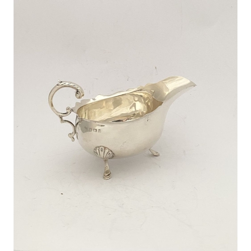 89 - AN ELEGANT EDWARD VII SILVER SAUCE BOAT, by William Aitken, Vyse Street, Birmingham c.1906. With gad... 