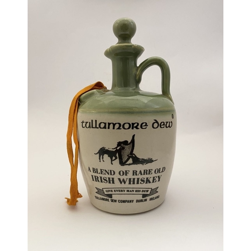 95 - A VINTAGE STONEWARE TULLAMORE DEW DECANTER, with wax seal to top embossed 1791, the front reading ‘T... 