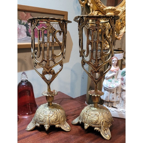 170 - A PAIR OF ANTIQUE ECCLESIATICAL CANDLE HOLDERS, highly decorative with scalloped border to top, the ... 