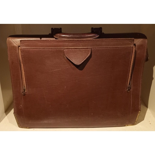 103 - A VINTAGE LEATHER BRIEFCASE, by Norris, dimensions: 43cm long x 34cm high approx.