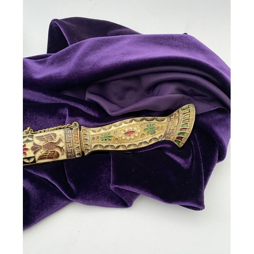 106 - A HIGHLY DECORATIVE BRASS ENAMELLED LETTER OPENER, the cover and handle with vibrantly coloured desi... 