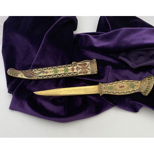 106 - A HIGHLY DECORATIVE BRASS ENAMELLED LETTER OPENER, the cover and handle with vibrantly coloured desi... 