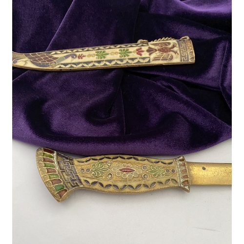 106 - A HIGHLY DECORATIVE BRASS ENAMELLED LETTER OPENER, the cover and handle with vibrantly coloured desi... 