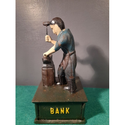 109 - A CAST IRON JOHN DEERE MECHANICAL MONEY BANK, in working order. Dimensions: 25cm high x 13cm wide x ... 