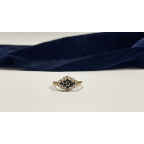 110 - A LOVELY ART DECO STYLE 9CT GOLD SAPPHIRE & DIAMOND CLUSTER RING, with central round cut sapphire su... 