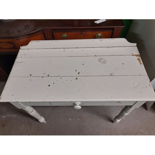 112 - A VICTORIAN IRISH PAINTED PINE FARMHOUSE CONSOLE TABLE, with centre drawer, raised on turned leg. Di... 