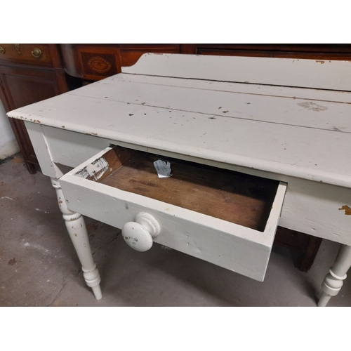 112 - A VICTORIAN IRISH PAINTED PINE FARMHOUSE CONSOLE TABLE, with centre drawer, raised on turned leg. Di... 