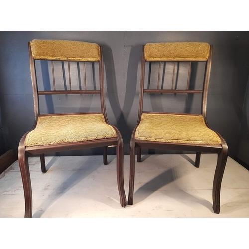 113 - A PAIR OF ANTIQUE MAHOGANY NURSING CHAIRS, with upholstered headrest above three bar spindles, uphol... 