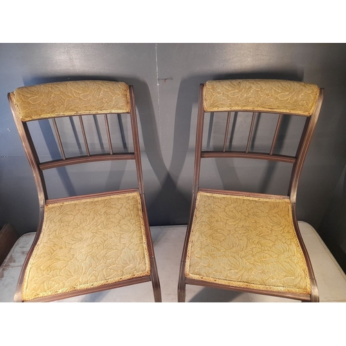 113 - A PAIR OF ANTIQUE MAHOGANY NURSING CHAIRS, with upholstered headrest above three bar spindles, uphol... 