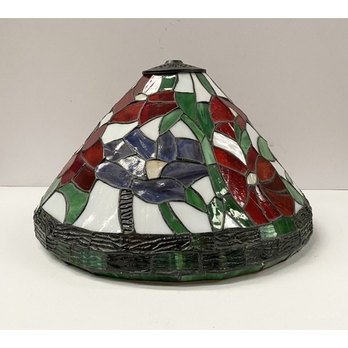 120 - A LARGE TIFFANY STYLE STAINED GLASS LAMPSHADE, floral design in vibrant colours with border to base,... 