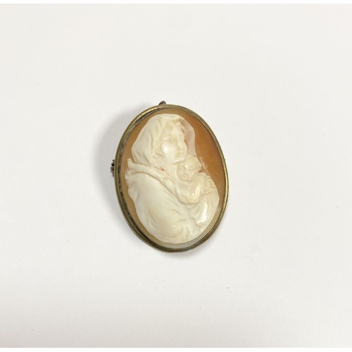 124 - A RELIGIOUS CAMEO BROOCH/PENDANT, oval form, highly carved, set on unmarked metal with pin clasp to ... 