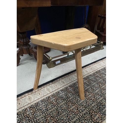 137 - A DON & EAMONN O’SULLIVAN, THREE-LEGGED STOOL, the shaped beech top raised on three carved legs made... 