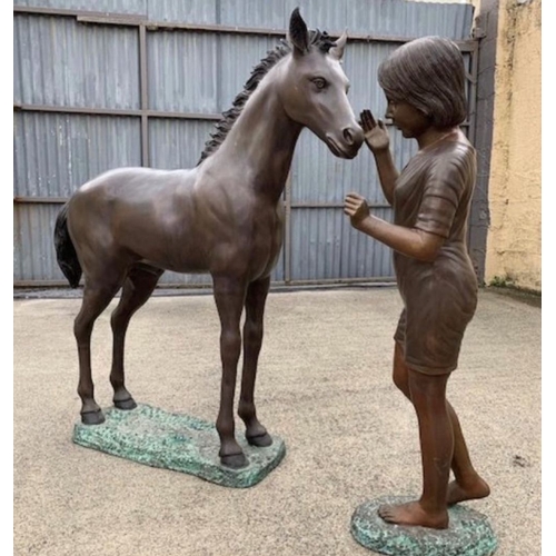 139 - A LARGE BRONZE GARDEN ORNAMENT/TWO PIECE SCULPTURE, in the form of girl petting foal. Highly detaile... 