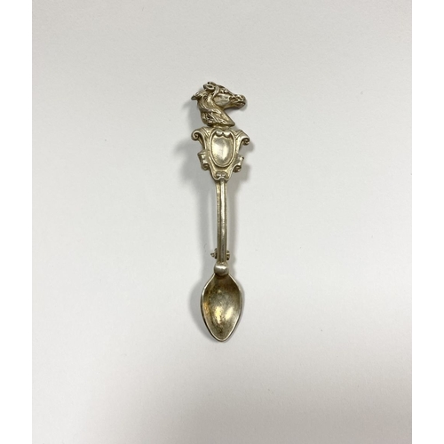 151 - A CHARMING STERLING SILVER SOUVENIR SPOON BROOCH, the handle mounted with blank cartouche below hors... 