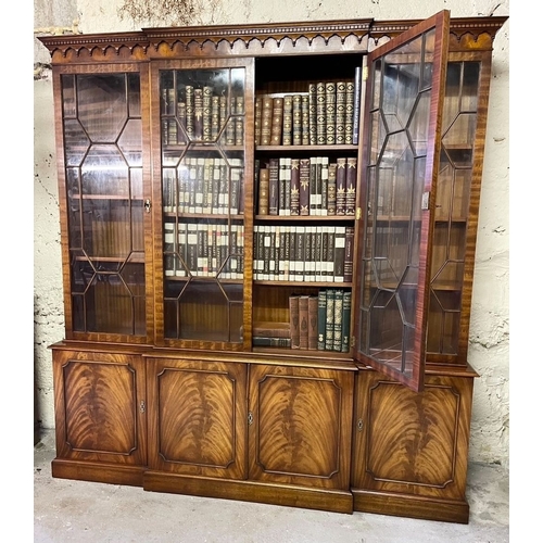 169 - A BEAUTIFUL MAHOGANY BREAKFRONT ASTRAGAL GLAZED LIBRARY BOOKCASE, to the top a dentil decorated pedi... 