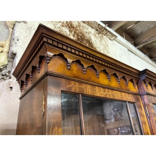 169 - A BEAUTIFUL MAHOGANY BREAKFRONT ASTRAGAL GLAZED LIBRARY BOOKCASE, to the top a dentil decorated pedi... 