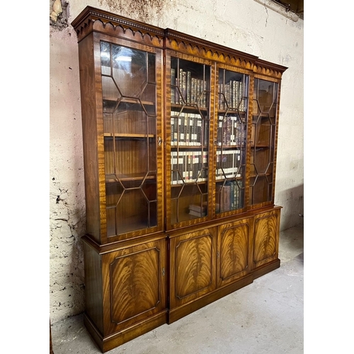 169 - A BEAUTIFUL MAHOGANY BREAKFRONT ASTRAGAL GLAZED LIBRARY BOOKCASE, to the top a dentil decorated pedi... 