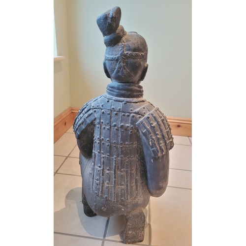 173 - A TERRACOTTA WARRIOR DECORATIVE ORNAMENTAL STATUE, in a knelling position. Dimensions: 67.5 x 32 x 2... 