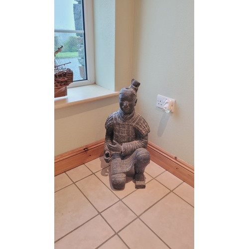 173 - A TERRACOTTA WARRIOR DECORATIVE ORNAMENTAL STATUE, in a knelling position. Dimensions: 67.5 x 32 x 2... 