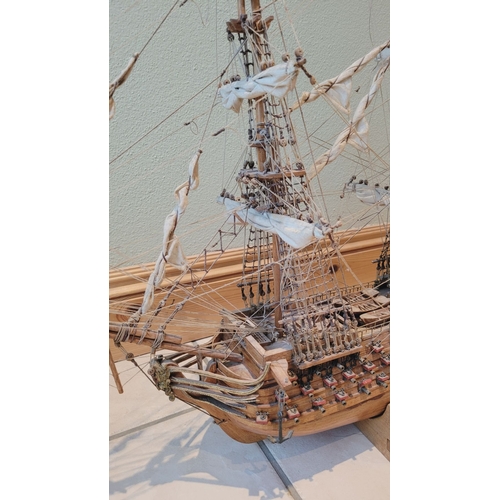 176 - A LARGE HANDMADE MODEL OF THE HMS VICTORY, made by a firm of model makers in Mauritius, Dimensions: ... 